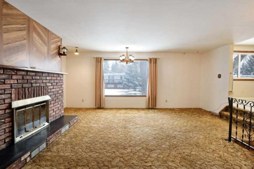 24 Beamish Park Drive East, Brooks, AB - Indoor With Fireplace