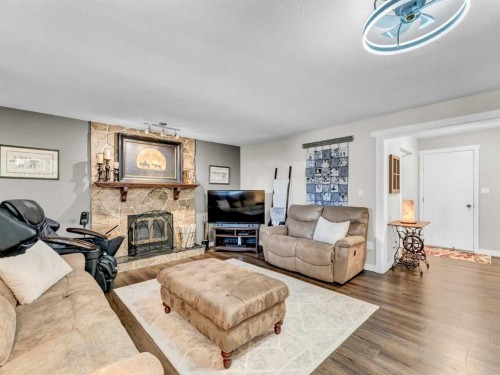 79 Fairview Way East, Brooks, AB - Indoor Photo Showing Living Room With Fireplace