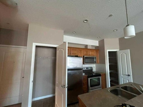 307-4403 67A Avenue, Olds, AB - Indoor Photo Showing Kitchen With Double Sink