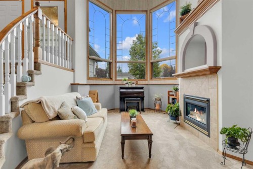 18 Asmundsen Close, Red Deer, AB - Indoor Photo Showing Living Room With Fireplace