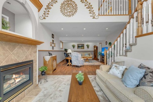 18 Asmundsen Close, Red Deer, AB - Indoor Photo Showing Living Room With Fireplace