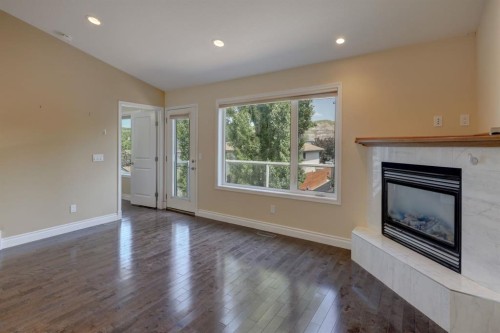 12 Garden Way, Drumheller, AB - Indoor Photo Showing Living Room With Fireplace