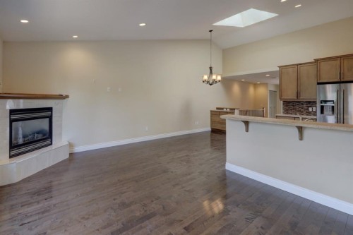 12 Garden Way, Drumheller, AB - Indoor Photo Showing Kitchen With Fireplace