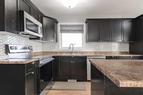 263 Upland Avenue, Brooks, AB - Indoor Photo Showing Kitchen With Double Sink