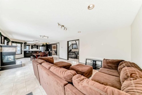 5 Chinook Crescent, Beiseker, AB - Indoor Photo Showing Living Room With Fireplace