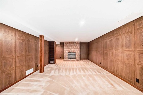 6623 Lethbridge Crescent Sw, Calgary, AB - Indoor Photo Showing Other Room With Fireplace