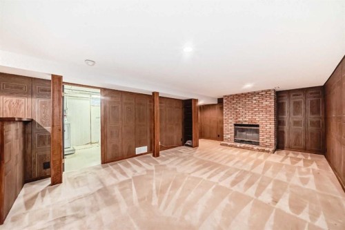 6623 Lethbridge Crescent Sw, Calgary, AB - Indoor With Fireplace