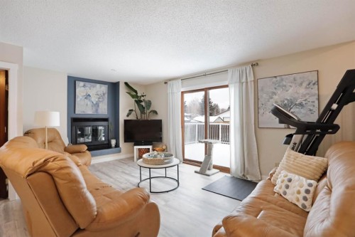 5 Fairview Crescent East, Brooks, AB - Indoor Photo Showing Living Room With Fireplace