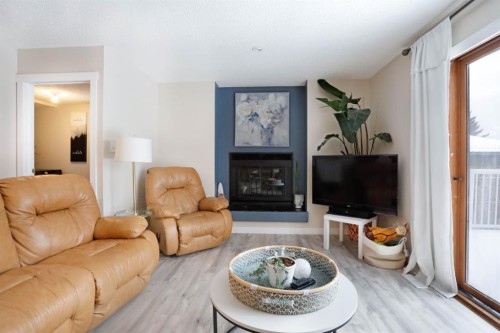 5 Fairview Crescent East, Brooks, AB - Indoor Photo Showing Living Room With Fireplace