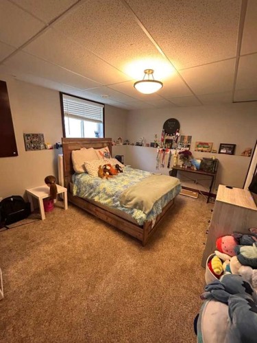 223 15 Street East, Brooks, AB - Indoor Photo Showing Bedroom