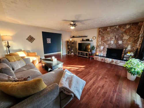 104 23 Street Nw, Drumheller, AB - Indoor Photo Showing Living Room With Fireplace