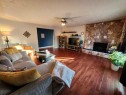104 23 Street Nw, Drumheller, AB  - Indoor Photo Showing Living Room With Fireplace 
