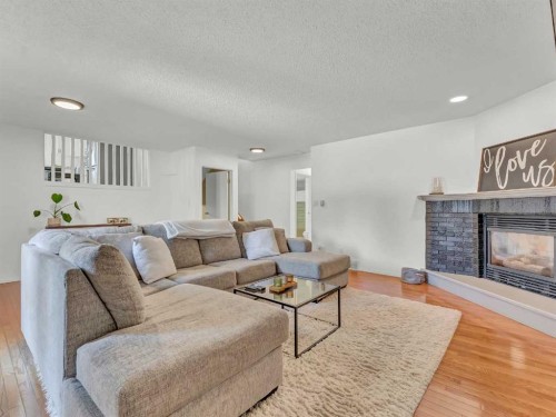 32 Upland Crescent, Brooks, AB - Indoor Photo Showing Living Room With Fireplace