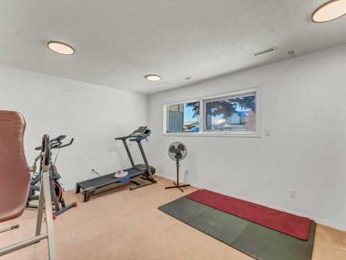 32 Upland Crescent, Brooks, AB - Indoor Photo Showing Gym Room