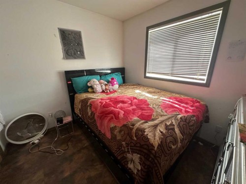 200 Upland Boulevard West, Brooks, AB - Indoor Photo Showing Bedroom