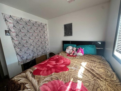 200 Upland Boulevard West, Brooks, AB - Indoor Photo Showing Bedroom