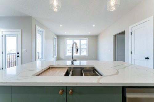 168 10 Avenue Se, Drumheller, AB - Indoor Photo Showing Kitchen With Double Sink