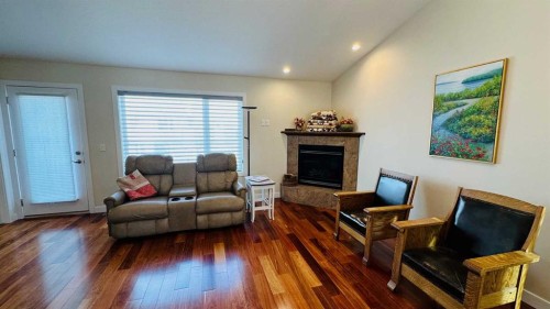 17 Garden Way, Drumheller, AB - Indoor Photo Showing Living Room With Fireplace