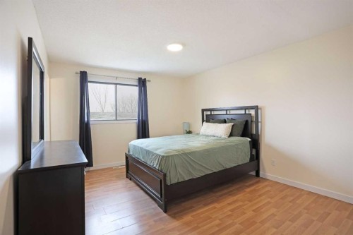 63 Ash Street West, Brooks, AB - Indoor Photo Showing Bedroom