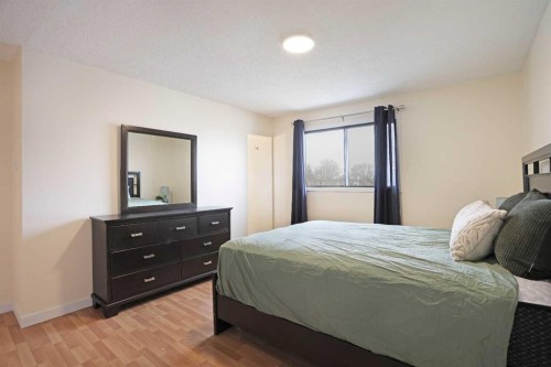 63 Ash Street West, Brooks, AB - Indoor Photo Showing Bedroom