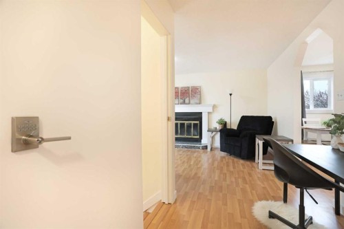 63 Ash Street West, Brooks, AB - Indoor With Fireplace