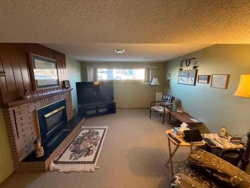 1023 2 Street Se, Drumheller, AB - Indoor With Fireplace