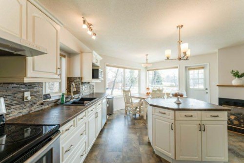 85 Michichi Drive, Drumheller, AB - Indoor Photo Showing Kitchen With Double Sink