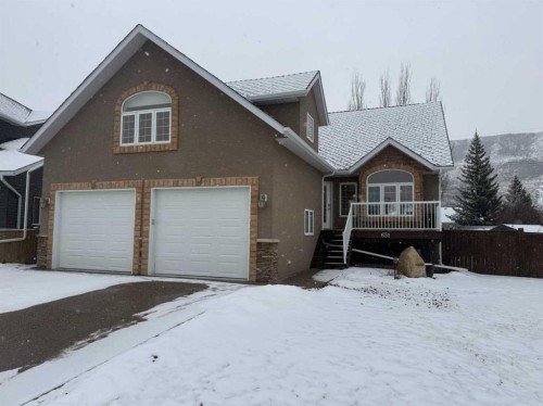 651 Greene Close, Drumheller, AB - Outdoor With Deck Patio Veranda With Facade