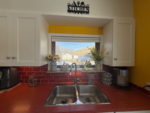 97 Villa Street, Drumheller, AB - Indoor Photo Showing Kitchen With Double Sink
