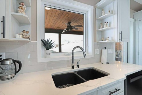 75 Upland, Brooks, AB - Indoor Photo Showing Kitchen With Double Sink
