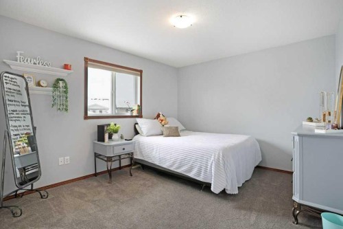 75 Upland, Brooks, AB - Indoor Photo Showing Bedroom