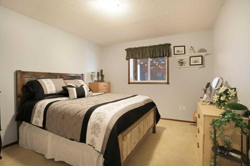 75 Upland, Brooks, AB - Indoor Photo Showing Bedroom