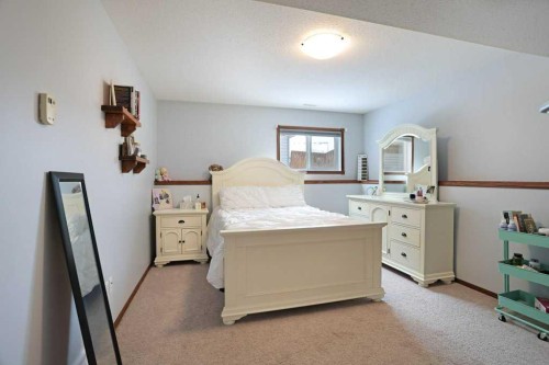75 Upland, Brooks, AB - Indoor Photo Showing Bedroom