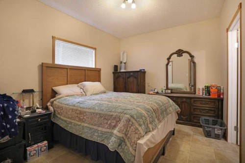 75 Upland, Brooks, AB - Indoor Photo Showing Bedroom