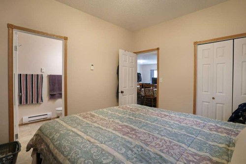 75 Upland, Brooks, AB - Indoor Photo Showing Bedroom