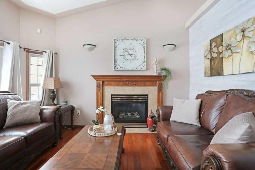 75 Upland, Brooks, AB - Indoor Photo Showing Living Room With Fireplace