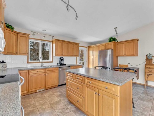 99 Greystone Close, Brooks, AB - Indoor Photo Showing Kitchen With Double Sink
