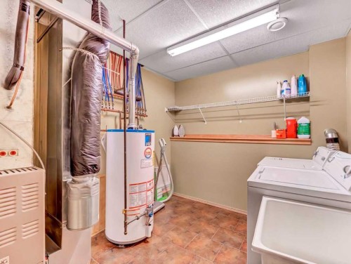 99 Greystone Close, Brooks, AB - Indoor Photo Showing Laundry Room