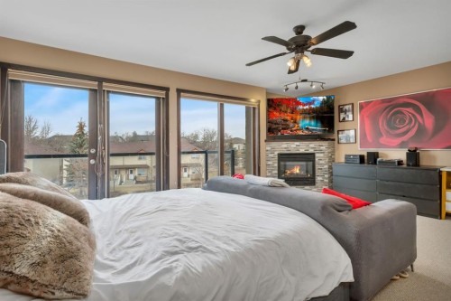 5221 Westridge Drive, Blackfalds, AB - Indoor Photo Showing Bedroom With Fireplace