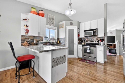 76 Crystalridge Crescent, Okotoks, AB - Indoor Photo Showing Kitchen With Stainless Steel Kitchen
