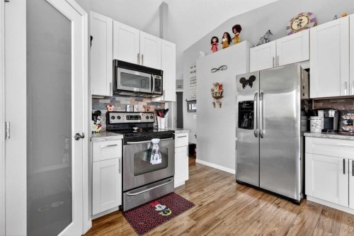 76 Crystalridge Crescent, Okotoks, AB - Indoor Photo Showing Kitchen With Stainless Steel Kitchen