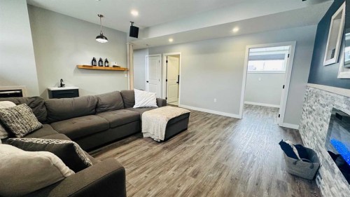609 1 Street Sw, Drumheller, AB - Indoor Photo Showing Living Room With Fireplace