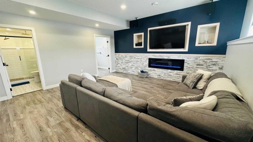 609 1 Street Sw, Drumheller, AB - Indoor Photo Showing Other Room With Fireplace