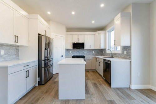 157 10 Avenue Se, Drumheller, AB - Indoor Photo Showing Kitchen With Stainless Steel Kitchen With Upgraded Kitchen