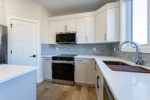 157 10 Avenue Se, Drumheller, AB - Indoor Photo Showing Kitchen With Upgraded Kitchen