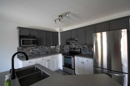 309 Bridleridge Way Sw, Calgary, AB - Indoor Photo Showing Kitchen With Stainless Steel Kitchen With Upgraded Kitchen