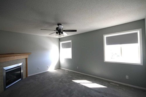 309 Bridleridge Way Sw, Calgary, AB - Indoor With Fireplace