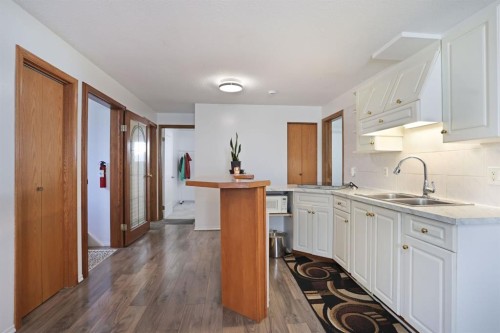28 Upland Crescent West, Brooks, AB - Indoor Photo Showing Kitchen With Double Sink