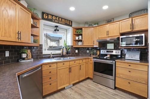 75 Parkland Close East, Brooks, AB - Indoor Photo Showing Kitchen With Double Sink