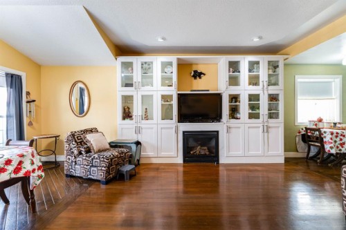145 Centre Street, Drumheller, AB - Indoor Photo Showing Living Room With Fireplace
